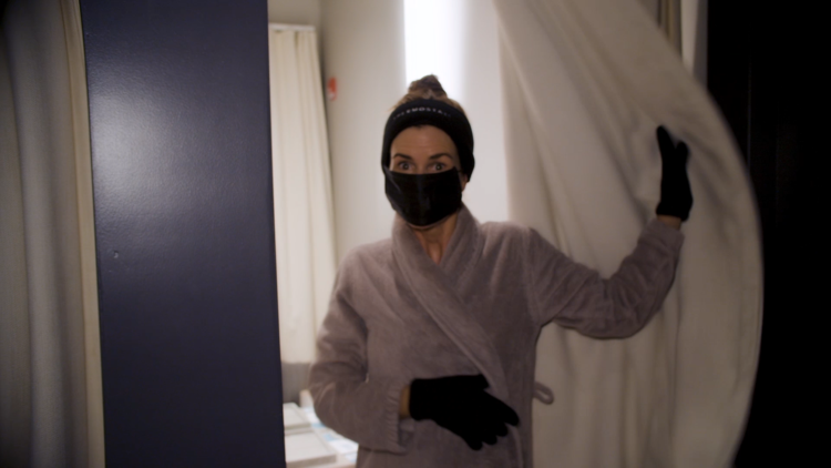Gucci Westman in a robe and face mask at a spa