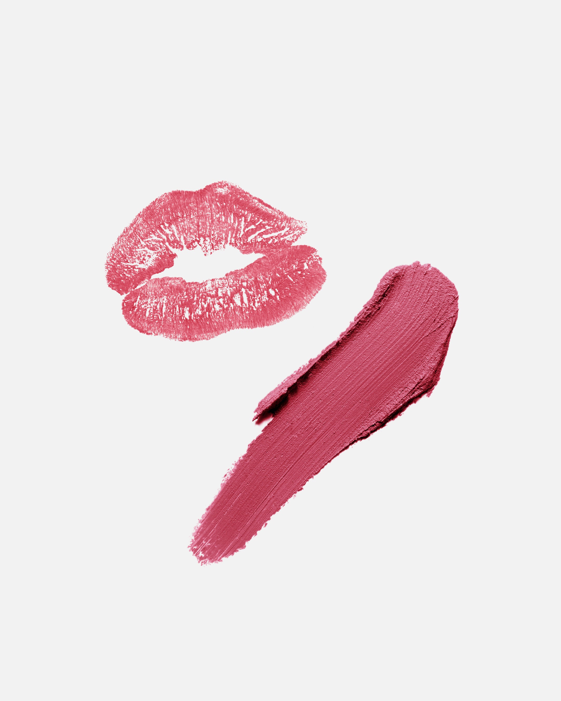 Pink lipstick kiss mark and swatch on a light pink background