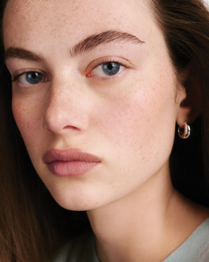 Model wearing HydroBalm in Cafe Creme.