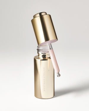 Eye Activator packaging & dropper application on grey background.