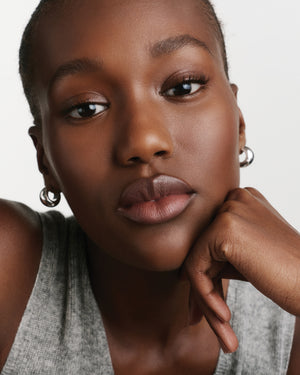 Model wearing HydroBalm in Juice.
