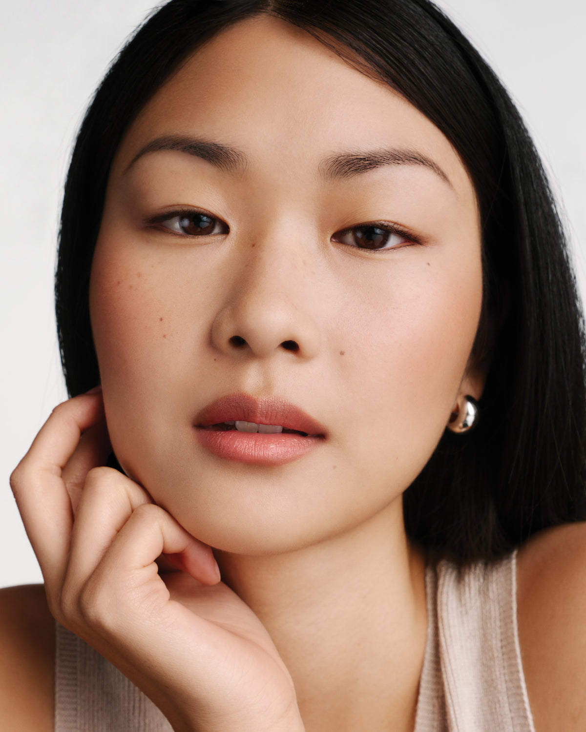 Model wearing HydroBalm in Juice.
