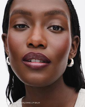 Model wears lip liner in Lou Lou. 