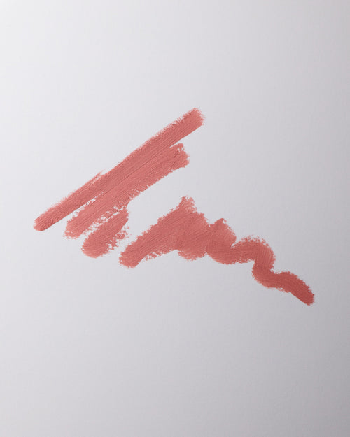 Lip liner swatch in Petal on grey background.