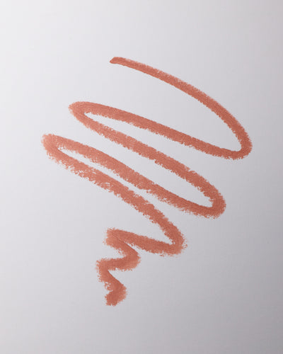 Lip liner swatch in Sable on grey background.