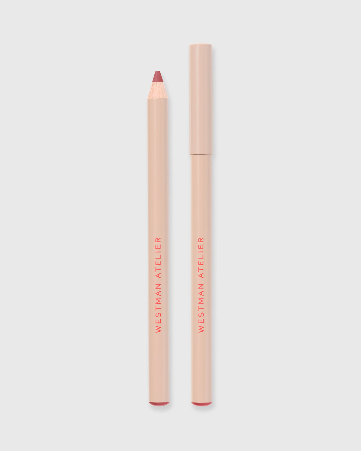 Lip liner in Je Reve on grey background.