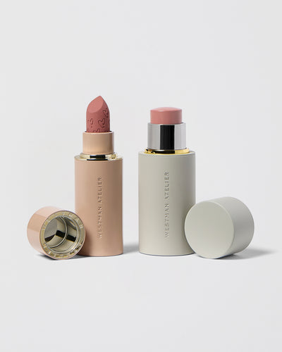 Lipstick and Blush Stick on grey background.