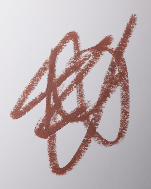 Lip liner swatch in Mink on grey background.