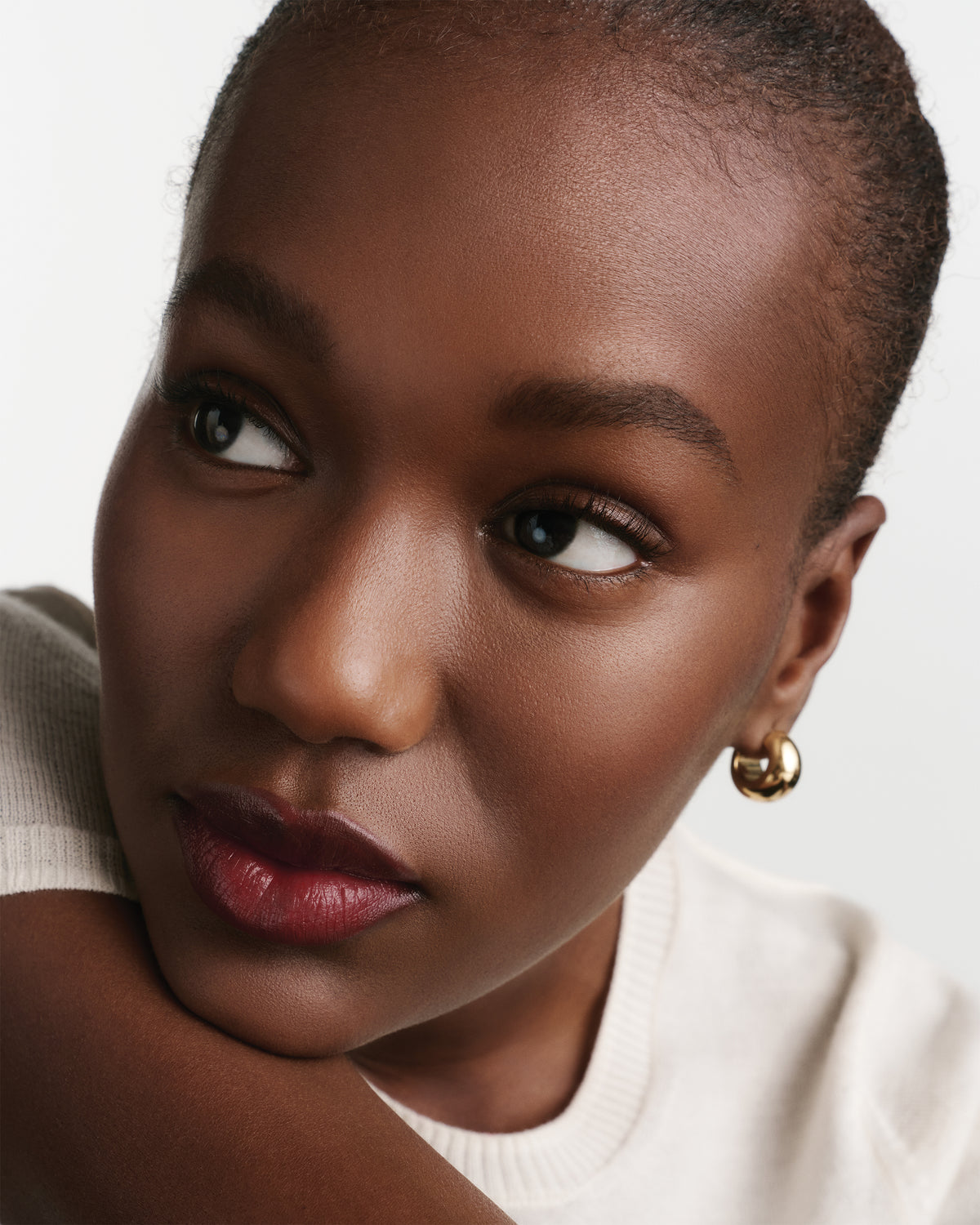 Close-up of a woman wearing red lipstick.