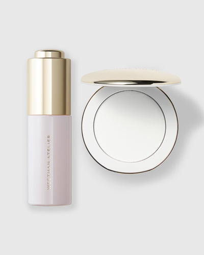Cosmetic bottle with gold cap and matching round mirror on a light gray background