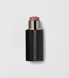 Black makeup stick with pink top on a light gray background.
